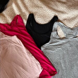 Lululemon Athletica 4 tank tops. Light Pink, Gray, Black and Fuchsia Racerback.
